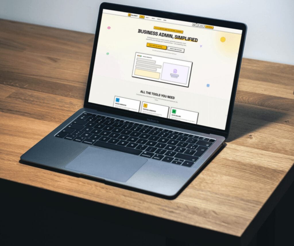 Laptop on textured rock surface displaying Bruno Anderson portfolio website with yellow-green background and iPhone mockup showing contact section