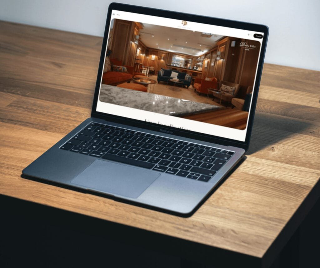 Smartphone on dark fabric showing UI/UX design learning app with bright yellow interface displaying course modules, user stats, and progress metrics