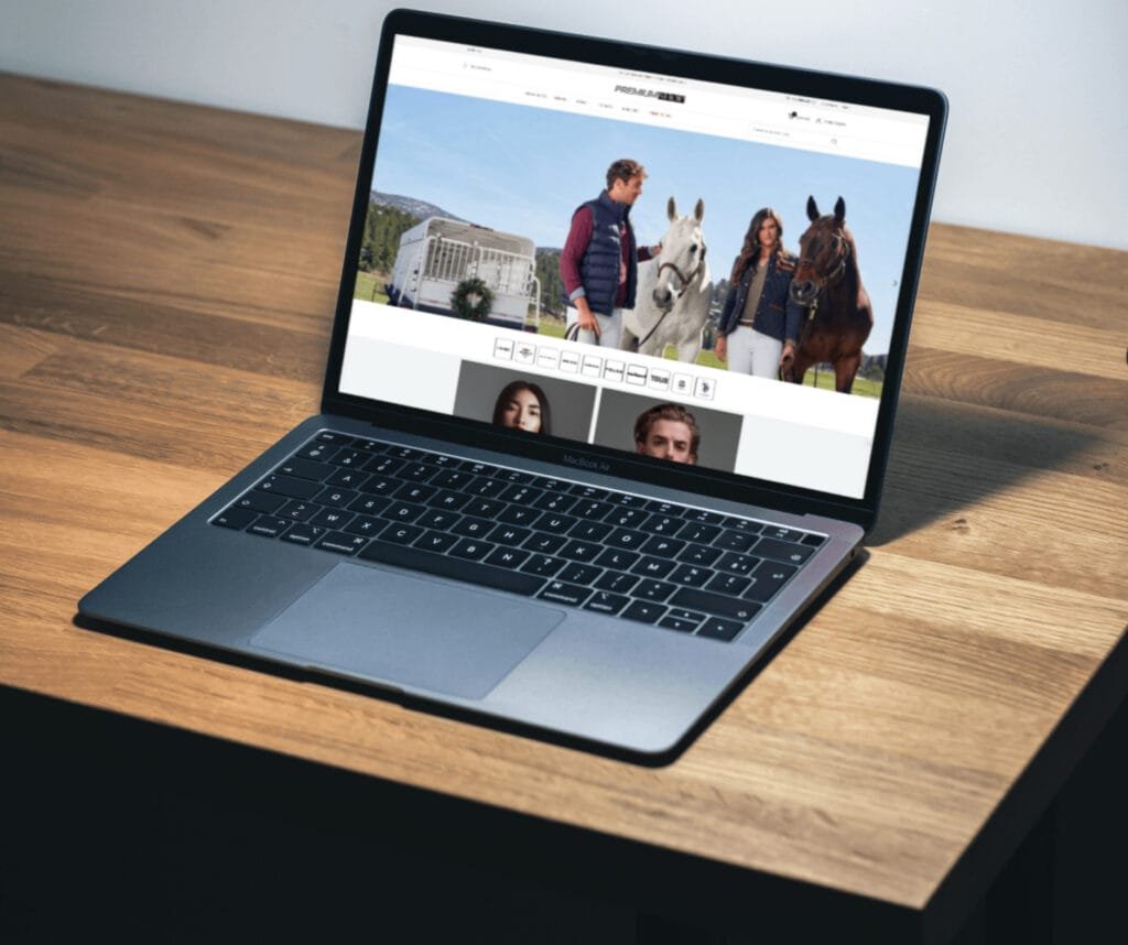 Laptop displaying Metal Studio website mockup with minimalist black and white design on modern curved surface with "MOCKUP" text prominently shown